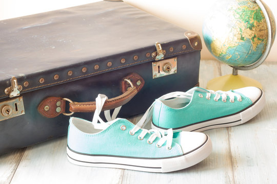 Travel Concept With Holiday Suitcase, Shoes And Globe
