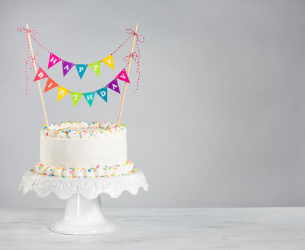 White Birthday Cake colorful bunting