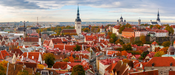 Aerial panorama of Old town with Town hall and Toompea hill, view from the tower of St. Olaf church, Tallinn, Estonia - obrazy, fototapety, plakaty