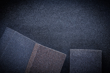 Fototapeta premium three abrasive sponges on sandpaper