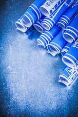 Blue construction drawings on metallic background maintenance co