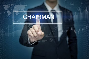 Businessman hand touching CHAIRMAN  button on virtual screen
