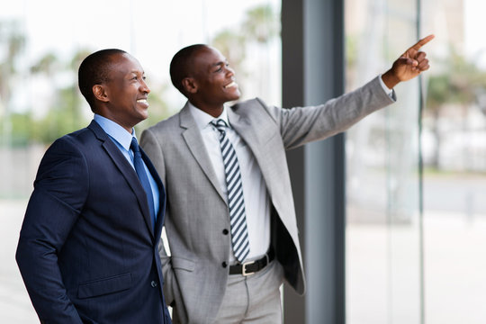 african business men pointing