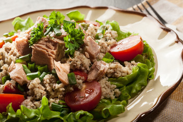 Tasty salad with couscous, tuna and vegetables