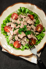 Tasty salad with couscous, tuna and vegetables