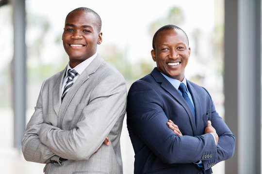 african businessmen with arms crossed