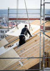 roofer building a roof