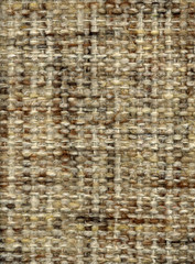 Handwoven fabric in beige and brown, close up