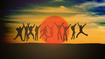 group of young people is jumping on top of the mountain