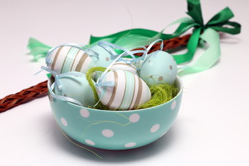 Decorated Easter eggs and a whip of willow twigs (Central Europe Easter symbol), isolated on white background