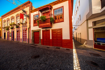 Famous ancient colorful balconies decorated with flowers in Santa Cruz city on La Palma island in Spain