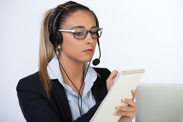 Beautiful young secretary working in office