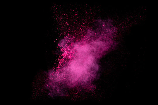 Color Explosion. Dust Particle Isolated on Black Background