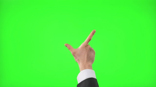 Young businessman making 12 touch screen hand gestures on green screen