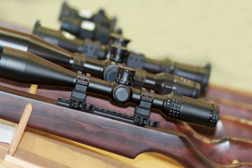Stand with hunting rifles with telescopic sights. Weapon