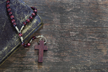 Rosary on wooden board