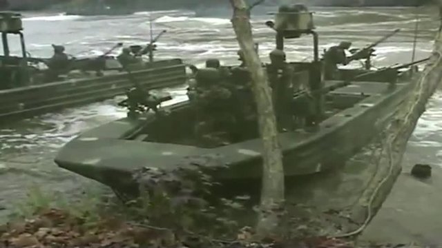 Special ops warcraft practice a river invasion exercise.