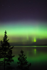 Northern lights over lake in finland