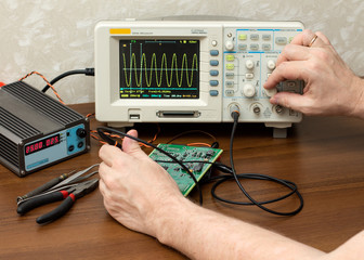 Workplace engineer. Oscilloscope.