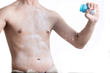 Man with a white powder on his body after shower isolated