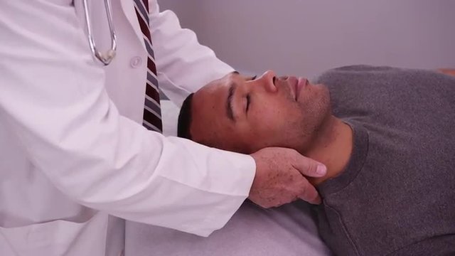 Handsome black male patient experiencing neck pain