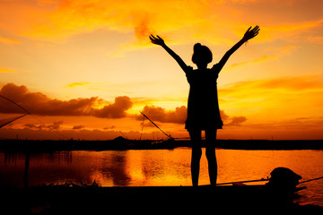 Fototapeta premium cute girl play at river sunset background