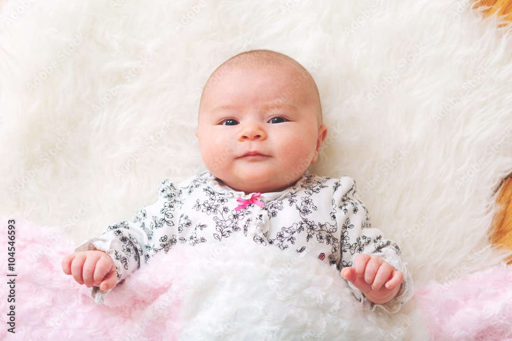 Wall mural Newborn baby girl on her blanket