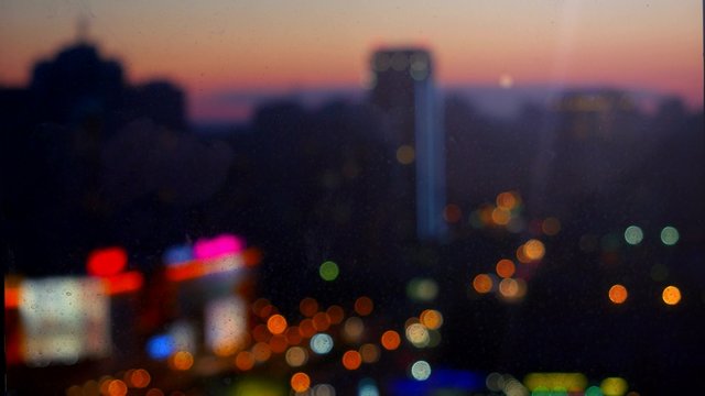 Blurred abstract background lights, beautiful cityscape view change focus at night. 4k