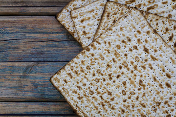 Matza on a rustic wood background