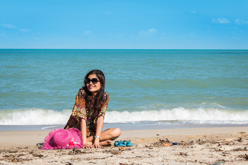 beauty women sitting at the beach