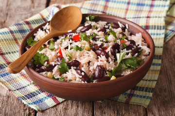 Healthy food: rice with red beans in a bowl close-up. horizontal
