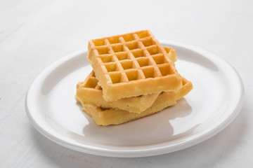 three waffles on plate