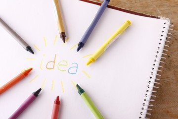 Colorful crayons and the word idea