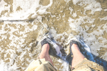 foot with shoe on the beach .