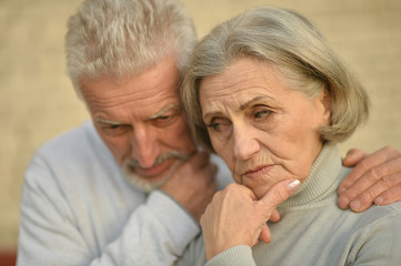 Mature couple near wall