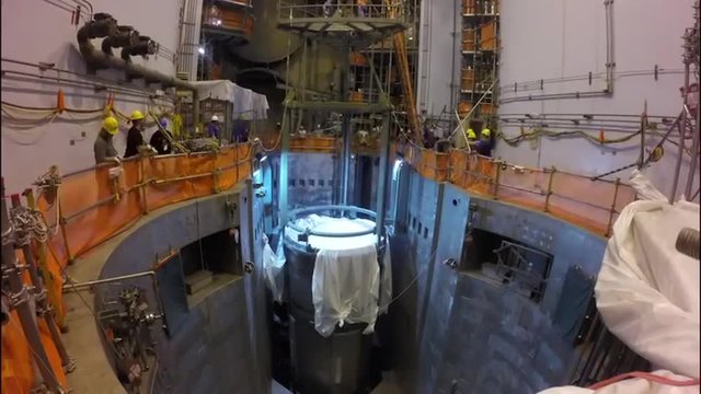 The core reactor of a nuclear power plant is put into place and fuel rod cells are added.