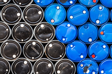 Black and blue oil barrels