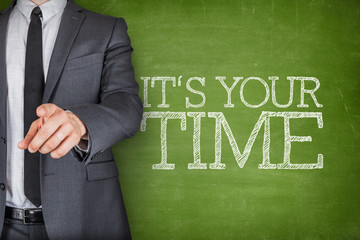 Win on blackboard with businessman on side