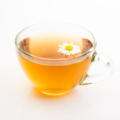 Natural camomile tea in glass cup