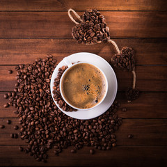 Tasty americano coffee with beans