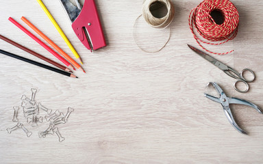Desktop mockup, top view, with colorful stationery and central copy space, on wooden background