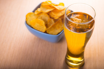 Glass of beer and chips