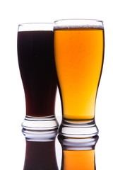 Dark and light beer into glasses