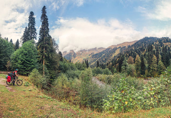 Fototapeta na wymiar landscape with man and bike in mountain hike