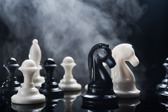 Chess piecess and smoke