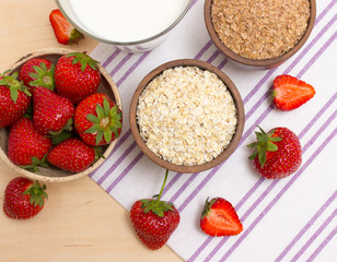 Oatmeal and strawberries on the table