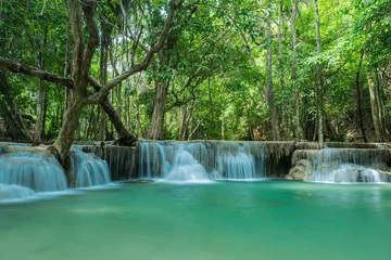 Foto op Plexiglas  Green nature landscape with turquoise waterfall © peangdao