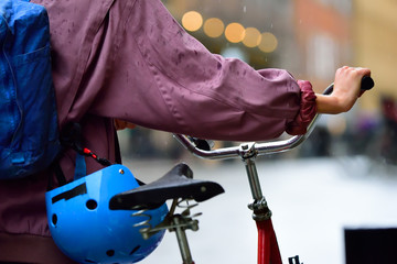 Woman and bike in the rain