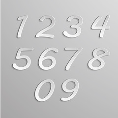 Paper numbers set on gray background