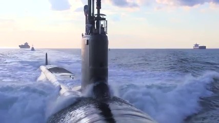 Excellent aerials over a submarine at sea.
